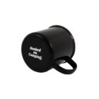 Black camping mug laying on its side with white text that reads Hooked on Camping!.