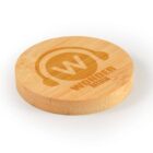 A round bamboo coaster with "WONDER MEDIA" and a stylized W logo with headphones, natural finish.