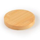A round wooden coaster with a smooth light brown surface, on a white background.