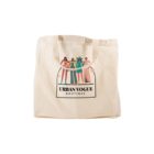 A beige tote bag with an illustration of four stylish people and "Urban Vogue Boutique" below.