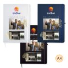 Three A4 booklets in white, blue, and black, titled WestBrook Apartments, and kitchen.