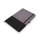 A grey and black fabric notebook with an elastic band and ribbon marker.