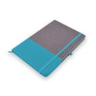 A closed gray fabric notebook with turquoise design, elastic closure, and ribbon bookmark.