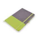 A closed green and gray notebook with a green elastic strap and ribbon bookmark on a white surface.