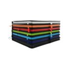 A stack of colorful notebooks with black covers, each featuring a different colored ribbon bookmark, arranged neatly on top of each other.