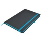 A closed black notebook with a bright blue elastic band and page marker lies flat. The cover has rounded corners, giving it a sleek and modern appearance.