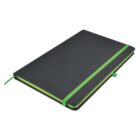 A black notebook with a green elastic band and bookmark is closed, lying flat. The edges of the pages are also green, matching the elastic and bookmark. The notebook has rounded corners.