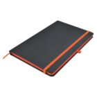 A closed, black notebook with rounded corners and an orange elastic band around it. The notebook also features an orange ribbon bookmark and an orange pen loop on the side.