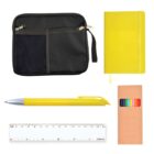 A neatly arranged collection of office supplies includes a yellow notebook, black zippered pouch with mesh pocket, yellow pen, cardboard box of colored pencils, and a white ruler marked in centimeters.