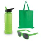 A collection of green items including a reusable water bottle with a black lid and straw, a canvas tote bag, and a pair of sunglasses with dark lenses.