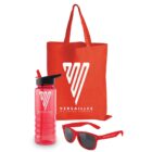 A red tote bag, a pink water bottle with a black cap, and red sunglasses. All items have the Versailles Wellness Centres logo.