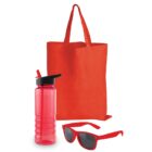 Red reusable tote bag, transparent red water bottle with a black flip-top lid, and a pair of red sunglasses with dark lenses, arranged on a white background.
