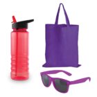 A red water bottle with a black lid and straw, a purple tote bag, and purple sunglasses with dark lenses are arranged on a white background.