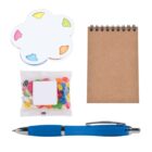 A collection of office supplies including a cloud-shaped sticky note pad with colorful tabs, a small brown spiral notebook, a packet of multicolored jellybeans, and a blue pen.