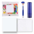 A collection of items including a clear packet of colorful jelly beans, a pen with a blue mop-top figure on top, a blue lip balm tube, a white microfiber cloth, and a transparent zipper pouch.