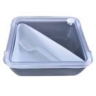 A square, black food storage container with a transparent lid featuring a circular knob. Inside, there is a white fork placed diagonally. The containers lid is slightly raised.