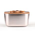 A rectangular, metallic container with a smooth finish, topped by a wooden lid secured with a brown strap. The lid features a decorative bow, providing an elegant and minimalist design. The container is set against a plain white background.