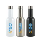 Three reusable water bottles are lined up side by side. From left to right, the bottles are white, metallic silver, and black. Each bottle features a blue GO TRAVEL logo with an orange arrow design beneath it.