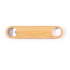 An oblong wooden bottle opener with two circular metal openings on either end, one with a metal edge for removing caps, placed on a white background.