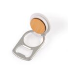 A bottle opener with a sleek design features a round wooden handle and a metal opening mechanism. The metal has a shiny finish and is attached to a white base.