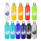 Eleven colorful water bottles in white, yellow, orange, red, light green, green, light blue, blue, navy, black, and silver. Each has a silver carabiner and a label with Into the Woods and tree graphics.