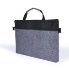 A gray felt laptop sleeve with a black zipper and two short black handles at the top. The design is sleek and modern, suitable for carrying and protecting a laptop or tablet.