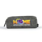 A gray fabric pencil pouch with a zipper, featuring a colorful logo of a house and the words HOME IMPROVEMENT CENTRES in yellow and purple text on its side.