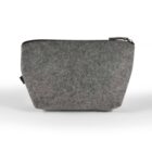 A gray felt zippered pouch with a minimalist design. The pouch is standing upright against a plain white background, showing its simple rectangular shape and textured material.