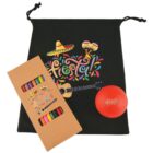 Fiesta-themed gift set featuring a black drawstring bag with colorful designs of a sombrero, maracas, and guitar. Includes a box of crayons showing similar graphics and a red ball with a fiesta pattern. Bright and festive presentation.