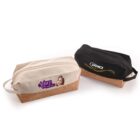 Two toiletry bags with cork bases, one beige with Adore Cosmetics logo and a womans face, and one black with Pro logo and yellow wave design. Both have zippers and side handles.