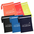 A set of colorful zipper bags in red, yellow, black, blue, and navy, each with a white zipper and strap. They feature the Little Learners Academy logo and a line drawing of children holding hands on the front.