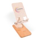 A foldable phone stand with a speckled beige design and an adjustable mechanism. It features the Social Pulse Media logo on the upper part and has a wooden base for stability.
