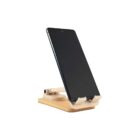 A smartphone on a wooden stand, angled slightly backward, with a plain white background. The stand has a simple, minimalist design.
