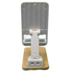 A small, white plastic and wooden phone stand on a white background. The stand features an adjustable angle mechanism and a stable base, designed to hold devices upright.