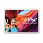 A promotional image for Western Australia featuring a smiling person making an OK hand gesture. The background shows a colorful, rocky canyon landscape. The text reads, Visit Western Australia and Deadmans Canyon, Kimberley Ranges.