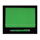 A green notebook with an elastic band closure is placed on a black background. Below the notebook, there is a silver and green pen.