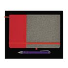 A closed notebook with a red and gray textured cover, secured by a red elastic band, placed on a black surface. A purple pen with silver accents is positioned below the notebook. Theres also a small red ribbon bookmark.
