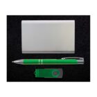 A silver cardholder, a green and silver pen, and a small green USB flash drive are arranged neatly on a textured black background.