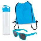 A set of bright blue items: a clear water bottle with a blue lid, a drawstring backpack, and a pair of sunglasses with blue frames and dark lenses.