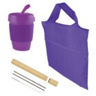 Reusable purple cup with lid, purple tote bag, bamboo case with metal and bamboo straws, and a cleaning brush against a white background.