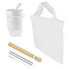 White travel mug with lid, white reusable bag, bamboo straw case, metal straw, straw cleaner, and wooden cap, arranged on a white background.