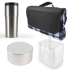 A stainless steel travel mug, a portable Bluetooth speaker, a plaid picnic blanket with a black carrying strap, and a white insulated cooler bag with handles are arranged against a plain background.