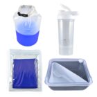 A blue and white waterproof dry bag, a clear shaker bottle with a white lid, a vacuum-sealed blue towel, and a square food container with a divided interior and fork, all arranged on a white background.