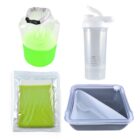 A set of four eco-friendly items: a collapsible water container with green liquid, a clear shaker bottle, a reusable green shopping bag in plastic packaging, and a square food container with a white lid and built-in utensils.