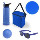 A collection of blue items including a water bottle, insulated lunch bag with a strap, round plate, bouncy ball, and sunglasses with dark lenses. The items are arranged against a white background.