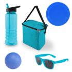 A collection of blue picnic items: a water bottle, cooler bag with strap, flying disc, ball, and sunglasses. All items are arranged on a white background.