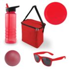 A collection of red-colored items: a water bottle, a cooler bag with handles, a plastic plate, a ball, and sunglasses. All are arranged on a white background.