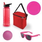 A collection of summer items: a pink water bottle with a black lid and straw, a red insulated lunch bag with a black strap, a pink flying disc, a purple ball, and pink sunglasses with dark lenses.
