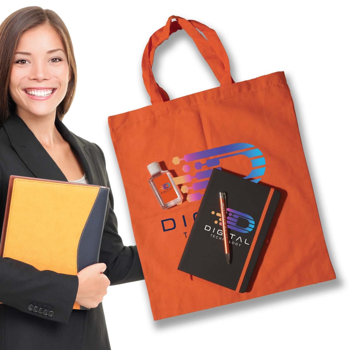 Smiling person holding a folder, standing next to an orange tote bag with a rainbow logo and the words DIGITAL TECHNOLOGY. Inside the bag are a small bottle, notebook, and pen, all with the same branding.