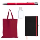 A red pen, a transparent bottle of hand sanitizer, a black notebook with a red ribbon bookmark, and a red tote bag are arranged against a white background.